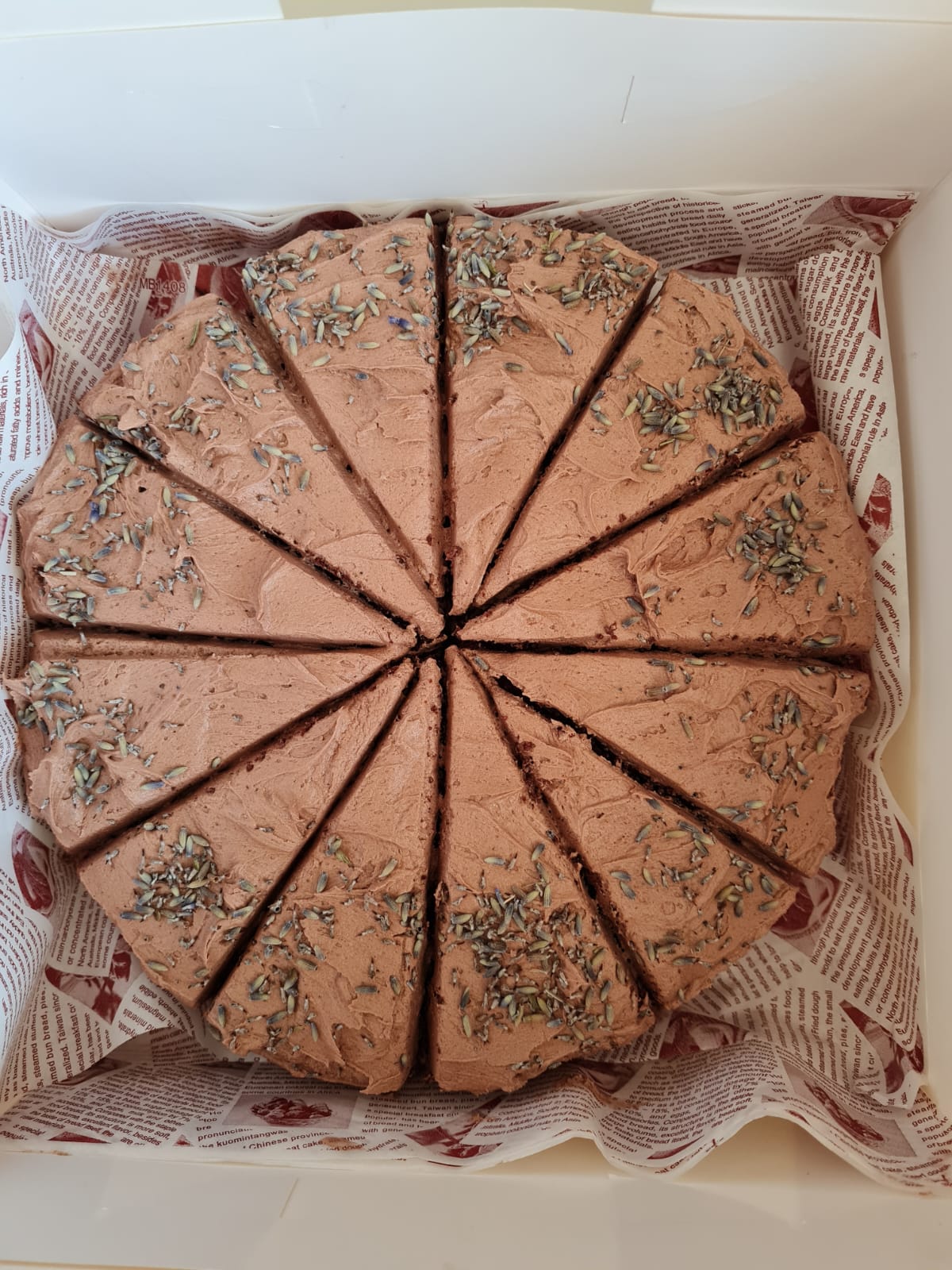 Sugar free chocolate cake with chocolate buttercream frosting and dried lavender buds, made with alternative flour